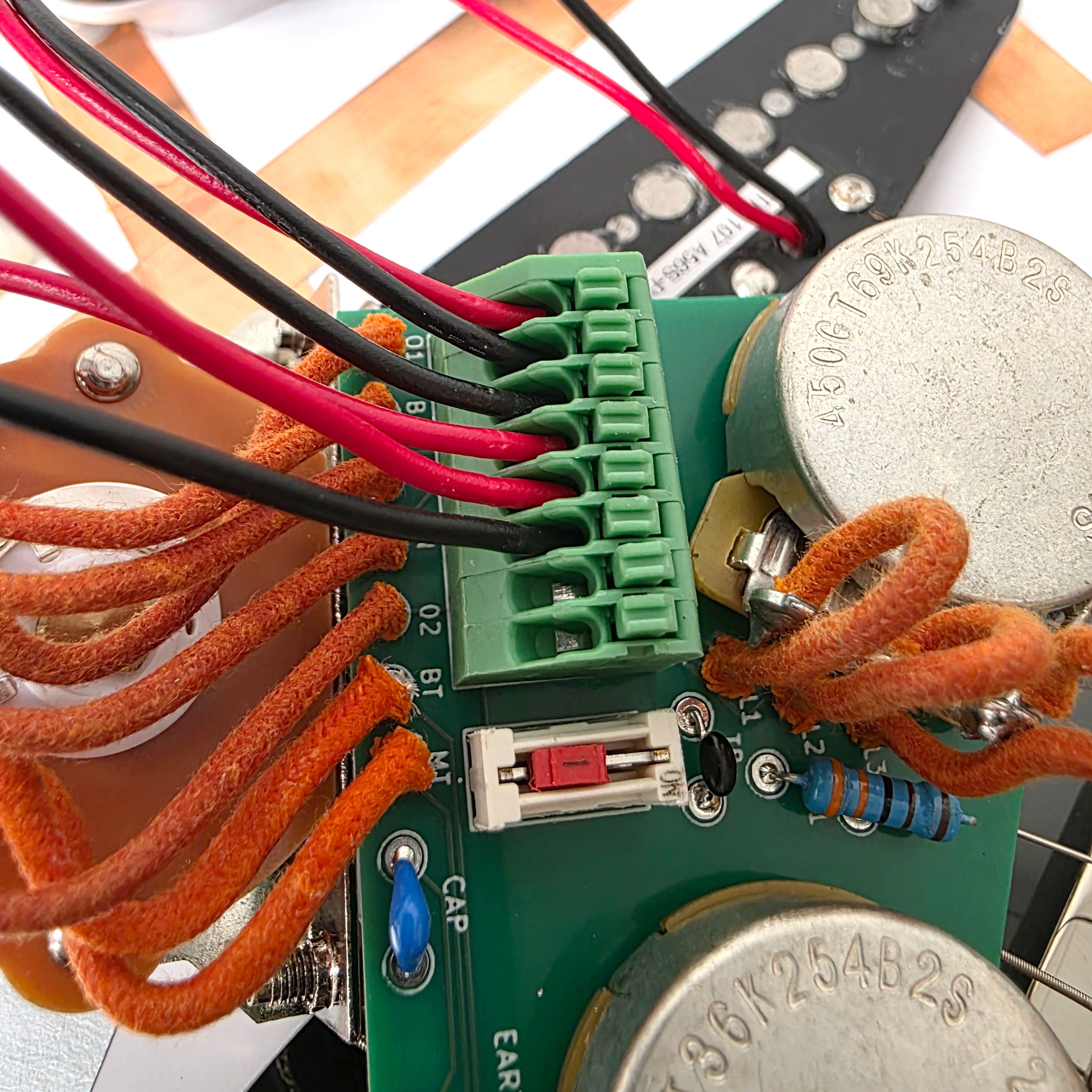 Close-up of a circuit board with wires and components.