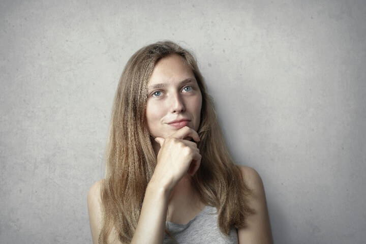 Woman Thinking With Her Hand On Her Chin 