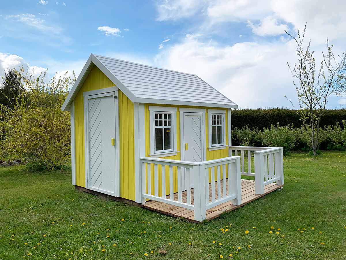  Yellow Wooden Playhouse Sunshine with a wooden terrace with white railing by WholeWoodPlayhouses