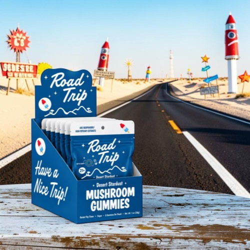 Display of mushroom gummies with a road trip theme and scenic highway background.