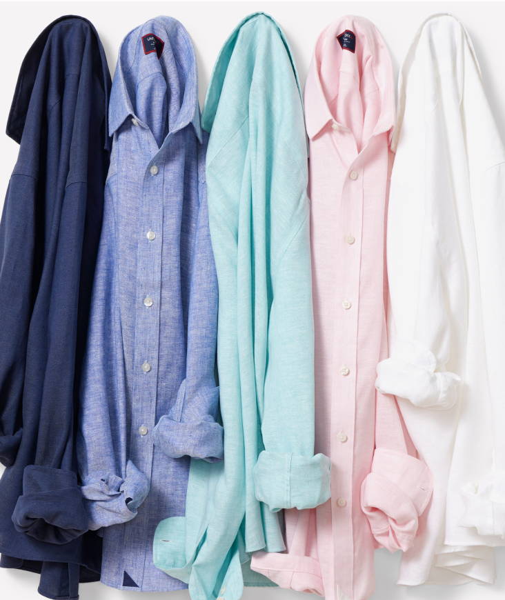 Collection of UNTUCKit button down shirts. 