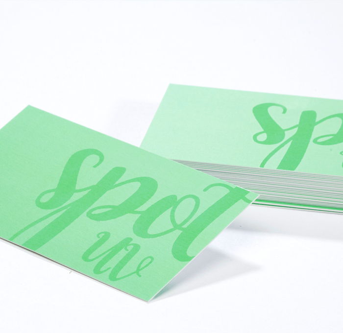 Raised spot uv business cards on a matte laminated card stock