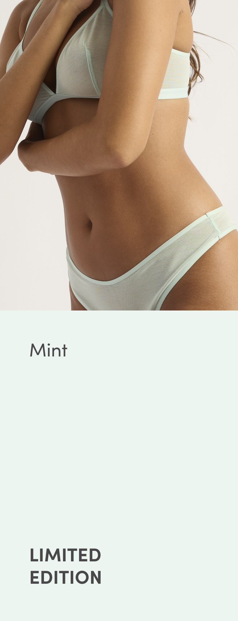 Model wearing mint-colored lingerie, text 