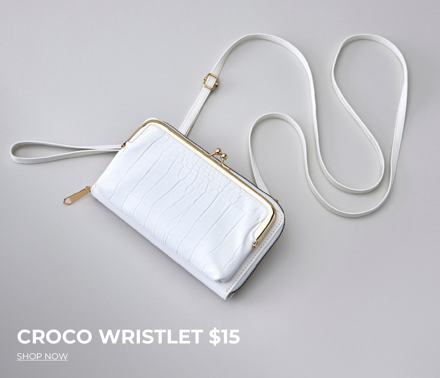 White croco wristlet with gold accents, priced at $15.