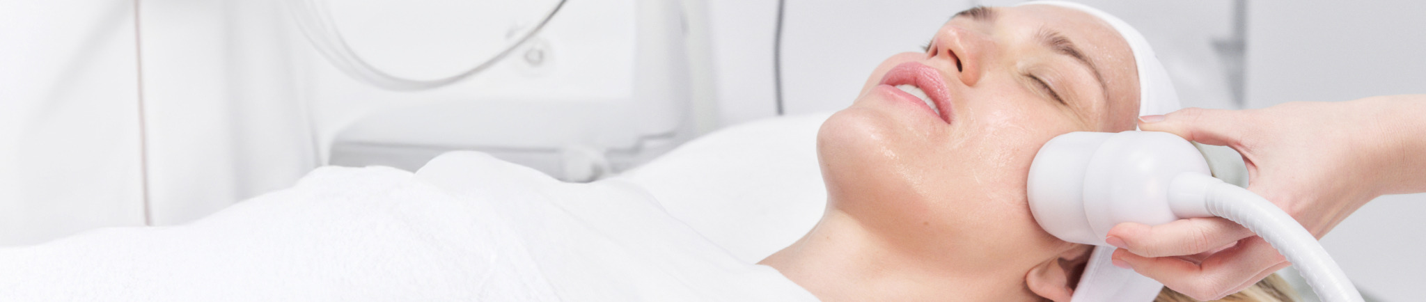 Person receiving a facial treatment in a spa setting.
