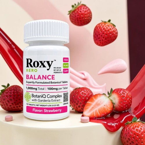 Bottle of Roxy Balance supplement with strawberries and cream background.