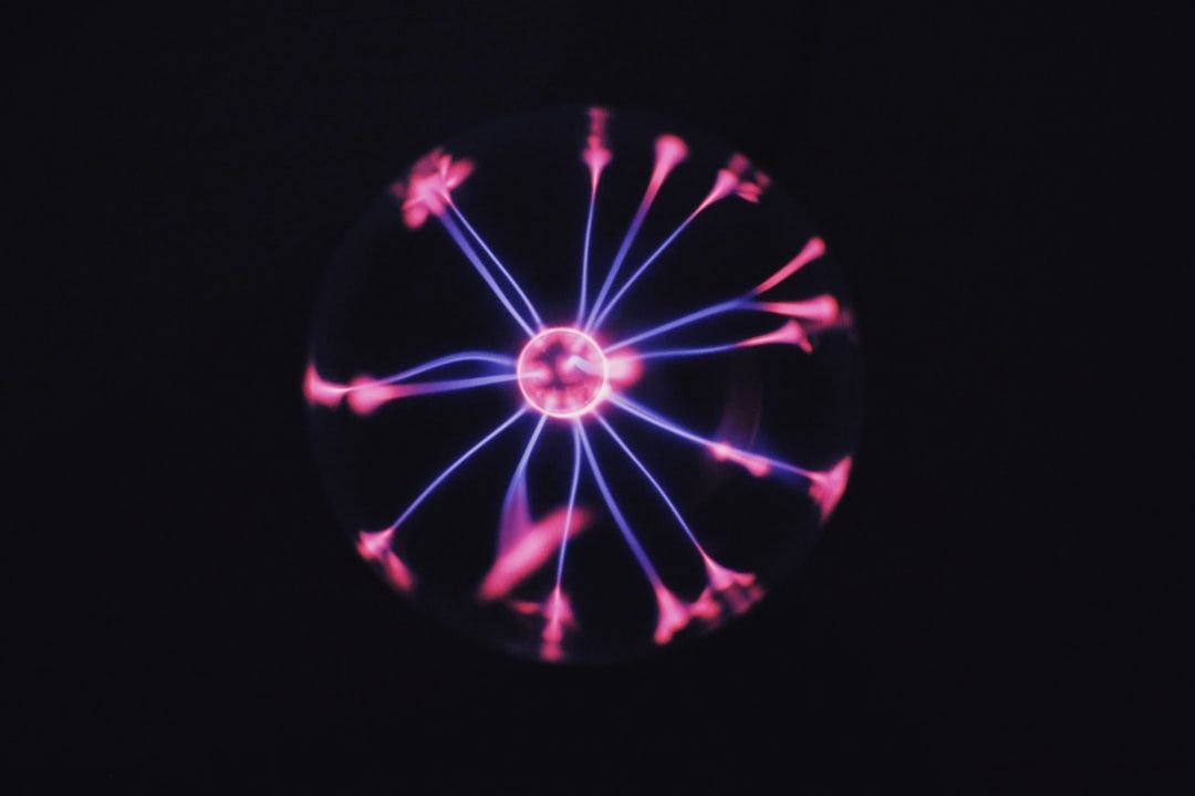 a close up of a spinning object in the dark