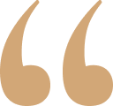 Brown quotation marks symbol.