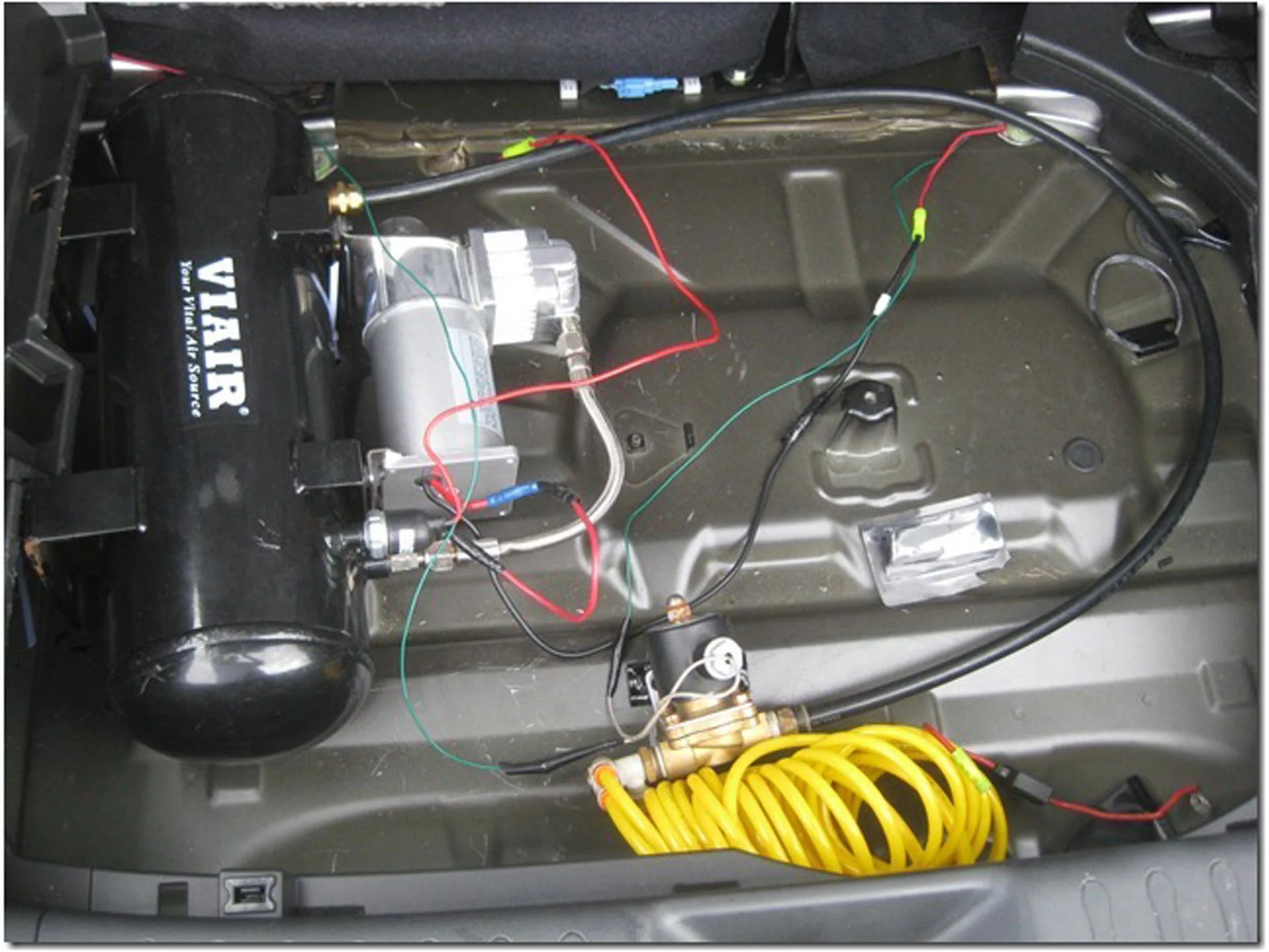 Shocker XL train horn mounting detail on Wesley's 2011 Nissan Juke showing bells bracket airlines and plumbing photo 4