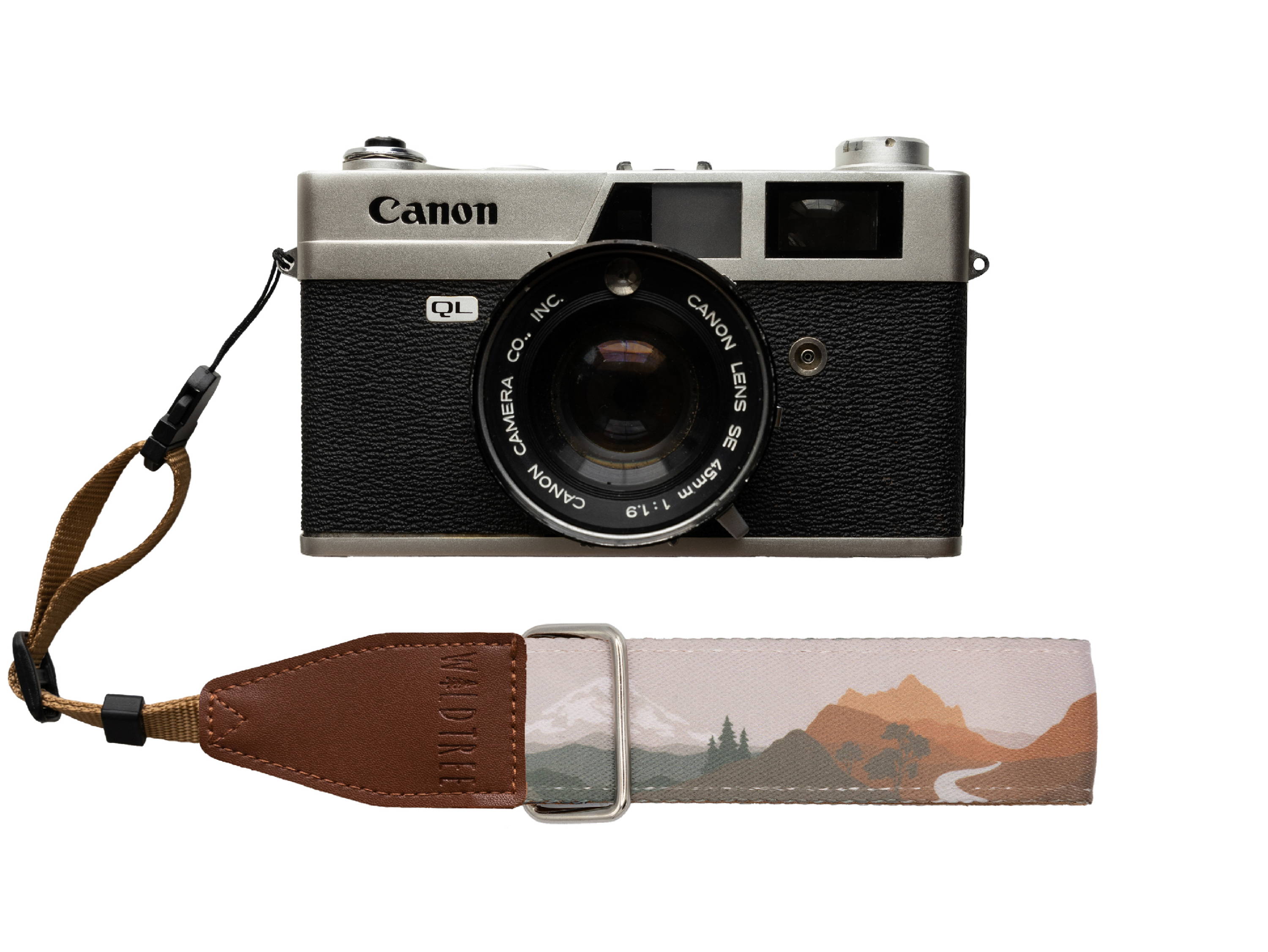 a cannon camera with a national park inspired camera wrist strap.