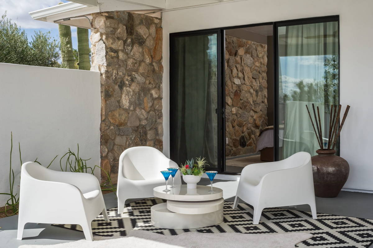Boxhill minimalist white modern outdoor lounge chairs and tables on geometric black and white rug