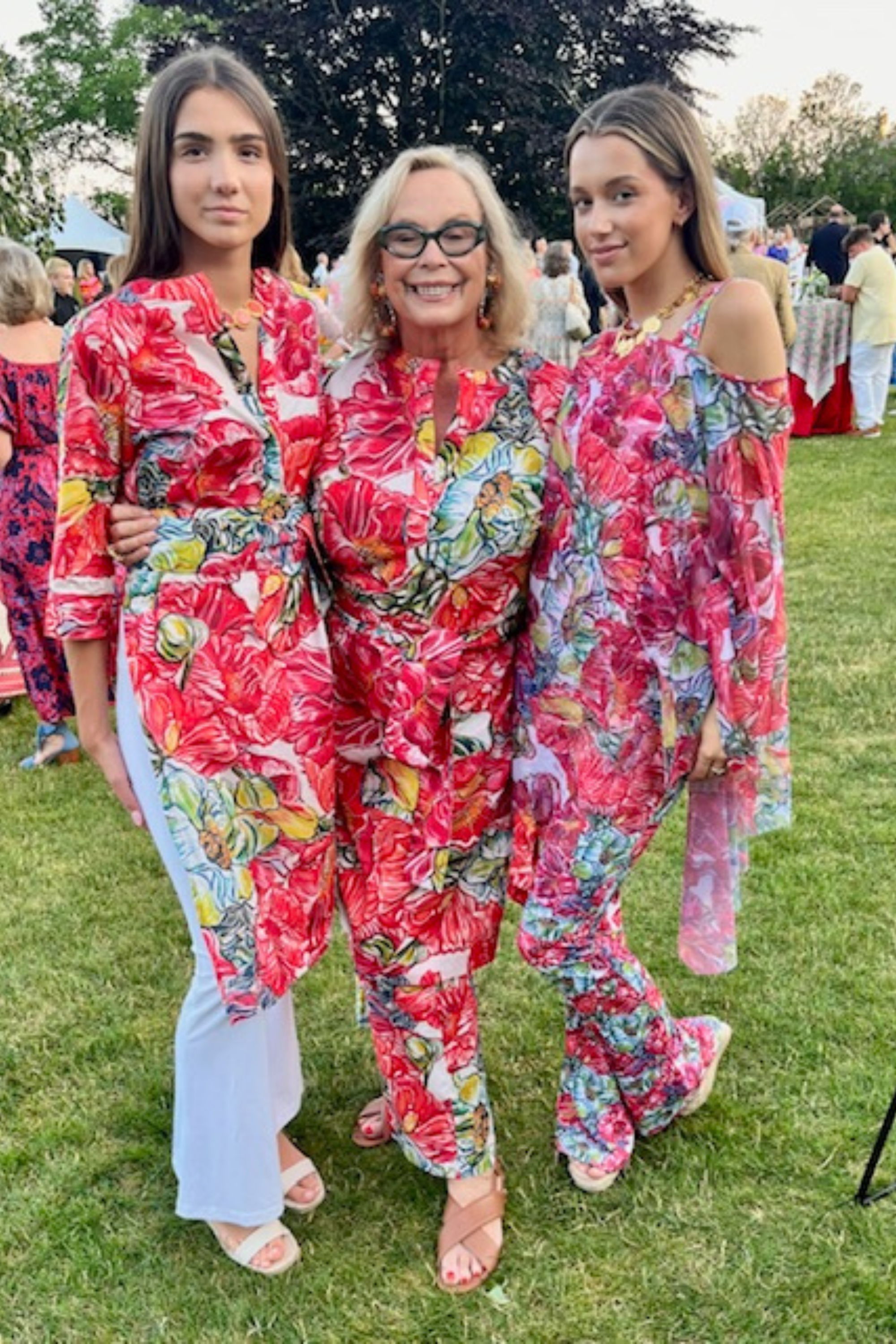 Ala and models wearing floral outfits by Ala von Auersperg for womens luxury travel clothing at the Newport Flower Show in Rhode Island at the Breakers Mansion