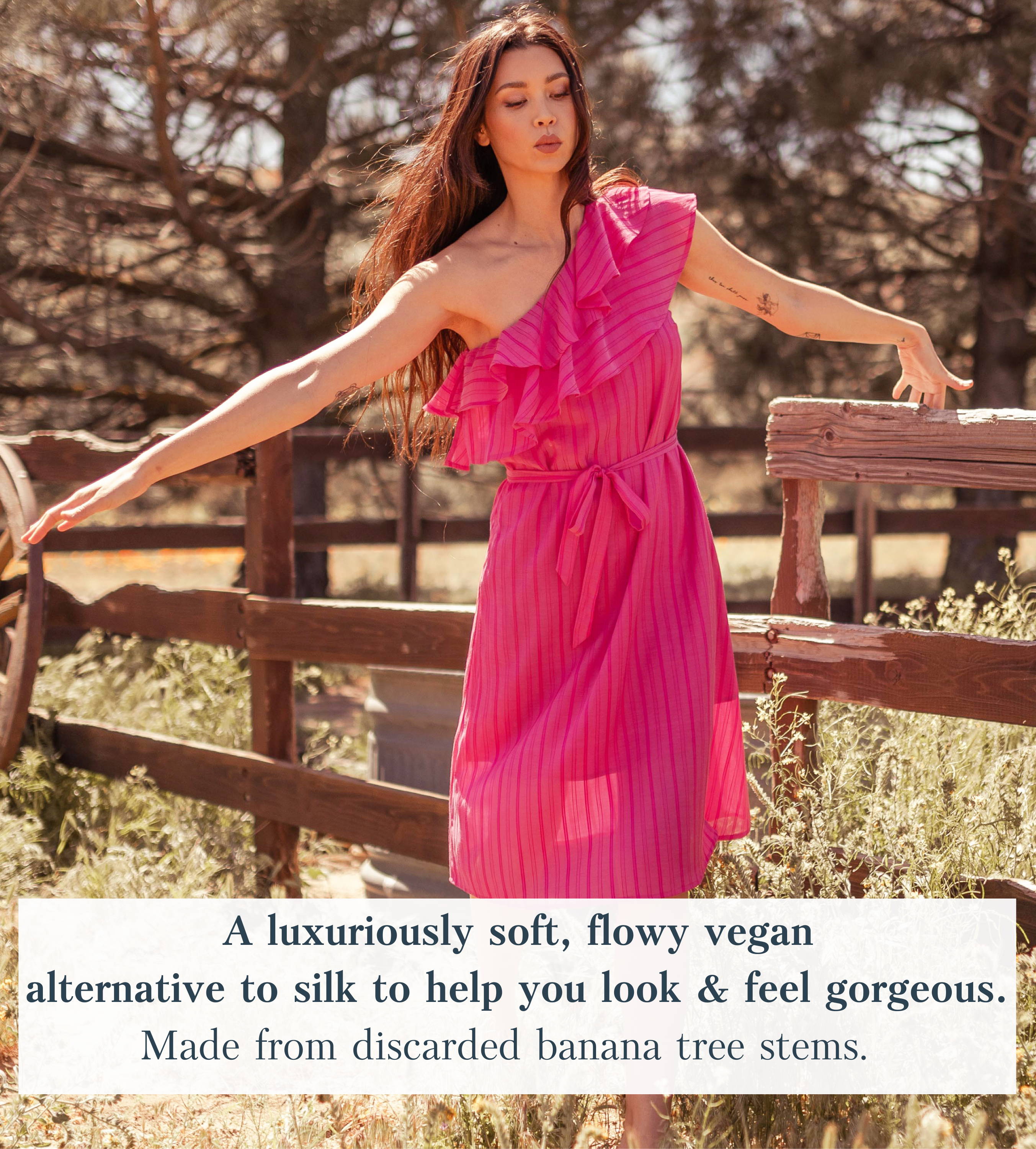 woman wearing sustainable pink midi dress with stripes