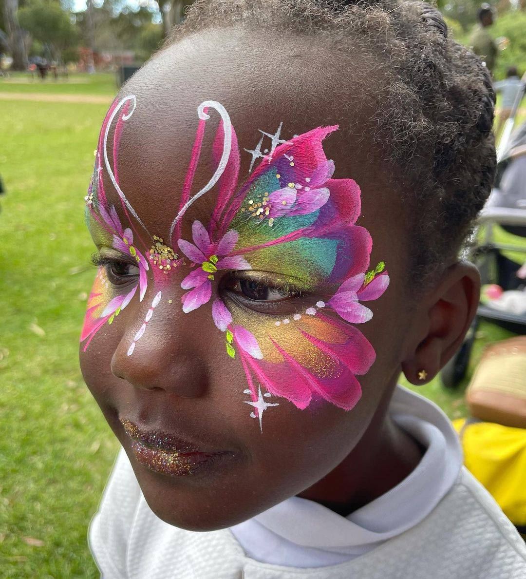 young girl butterfly face paint mask