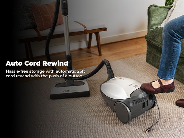 Vacuum with automatic cord rewind feature and foot control for storage.