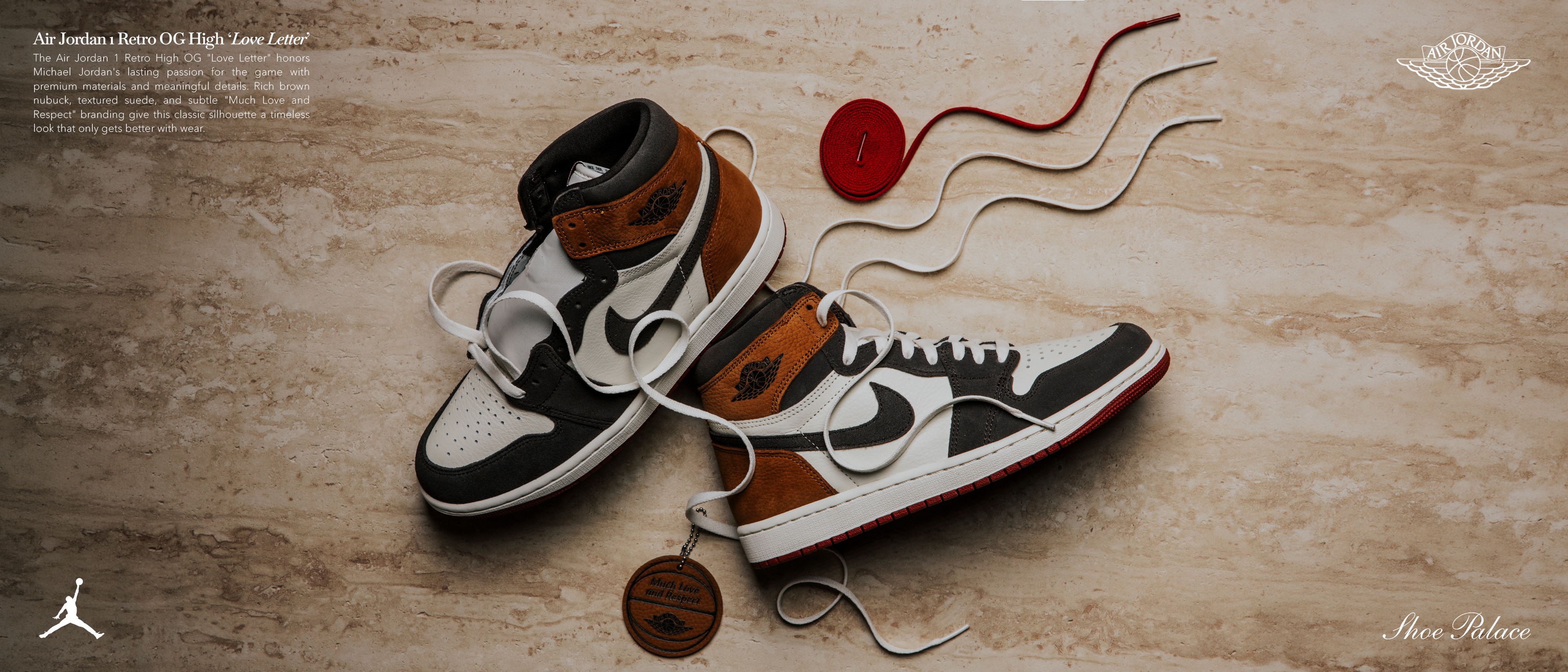 Stylish sneakers on a textured surface with accessories.