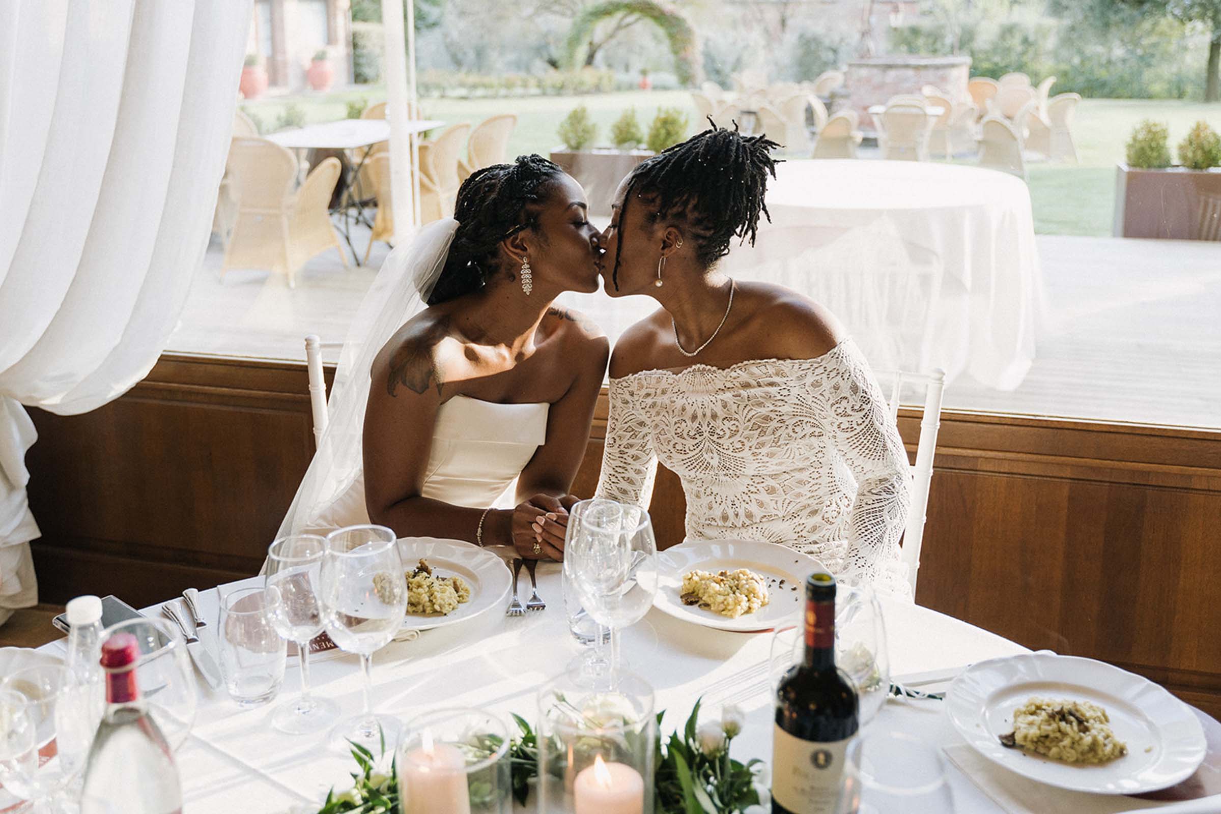 Two brides, sharing a romantic kiss