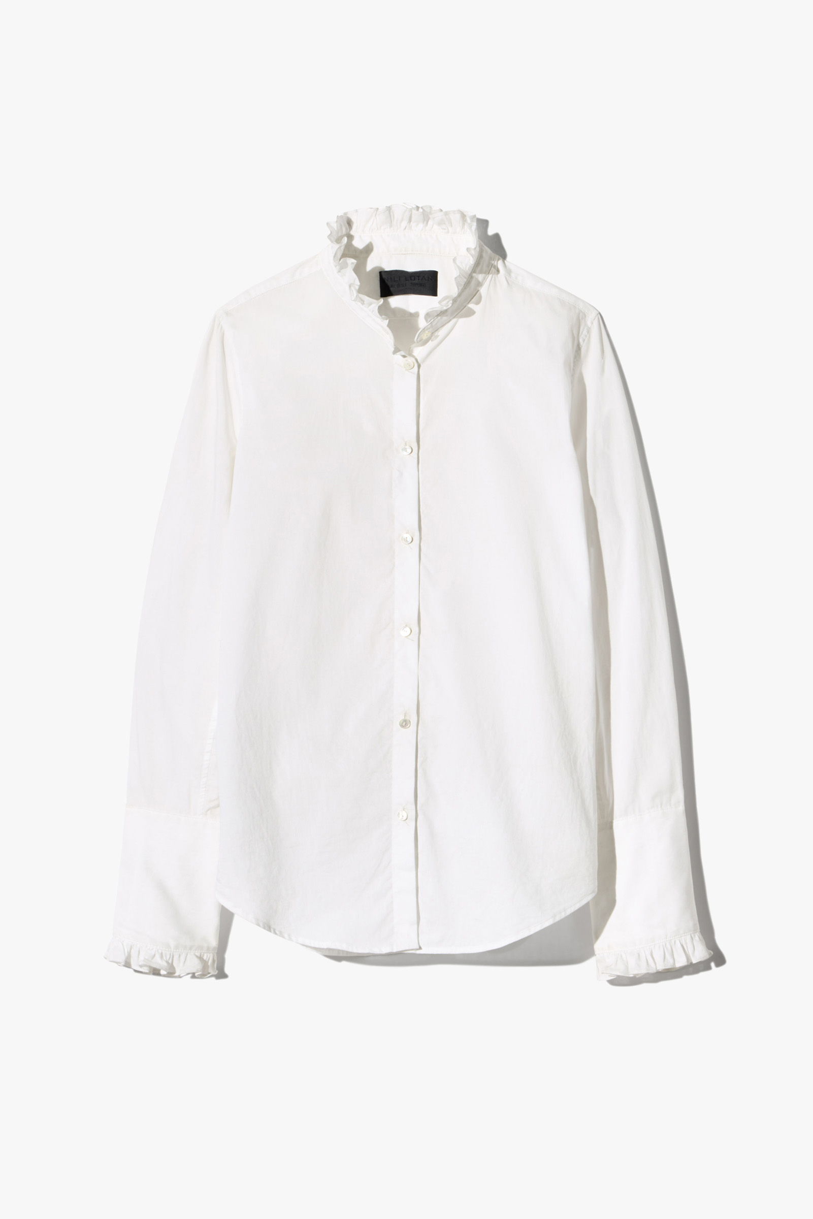 White shirt with frilled collar and cuffs.