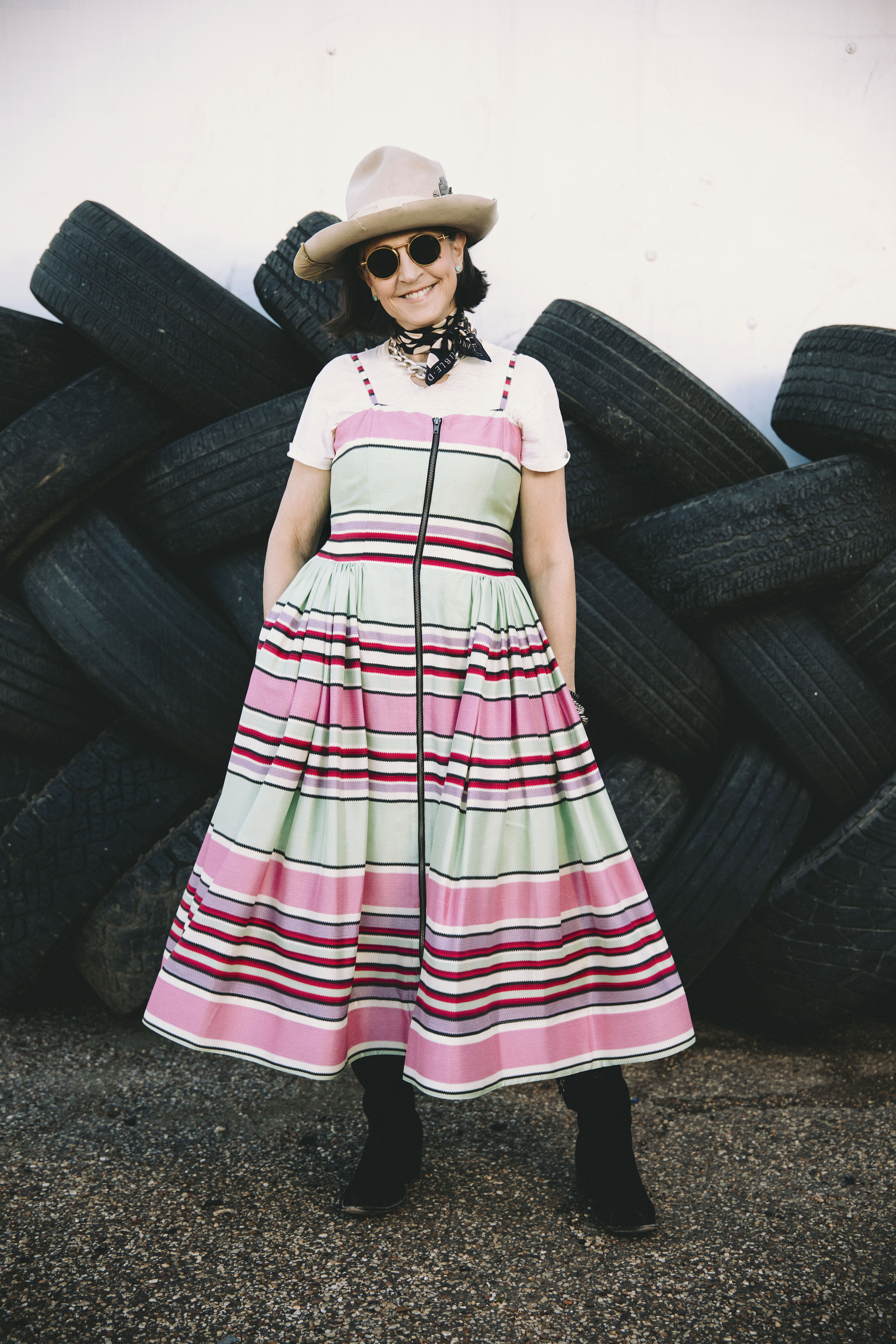 Cheryl wearing the Round Top Serape Dress with a white tee paired with Double D Ranch jewelry, accessories, and her Long Tall Sally boots.