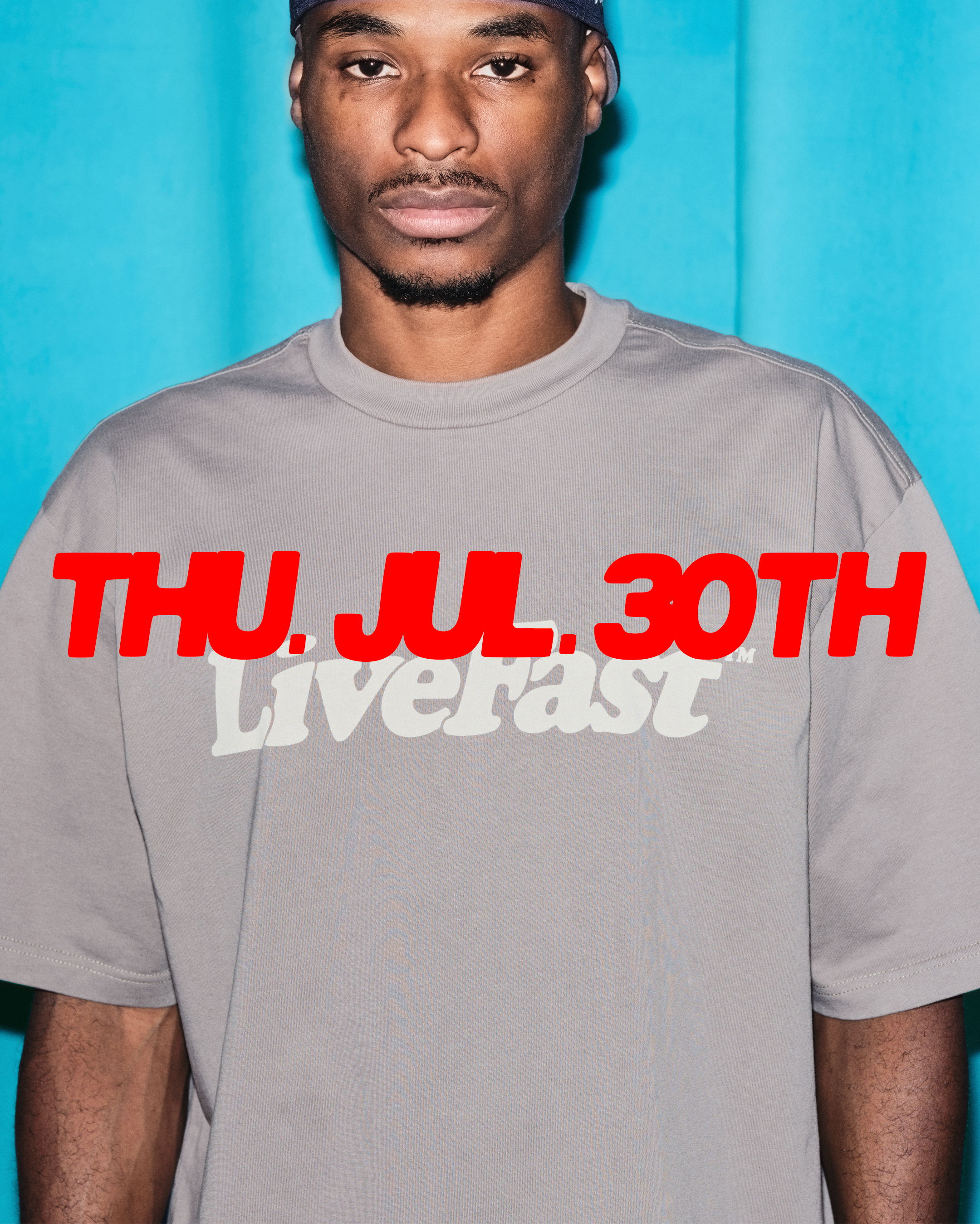 Person wearing a gray shirt with text on a blue background.