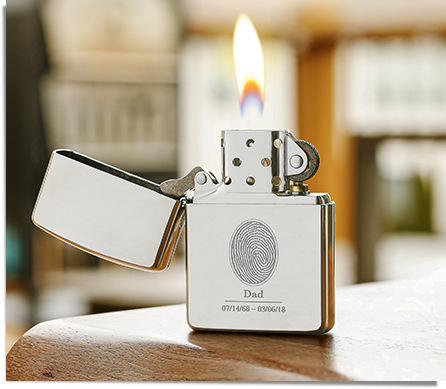 Zippo lighter engraved with a fingerprint, name, and dates
