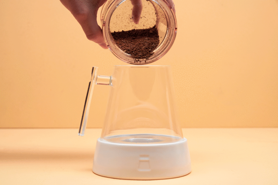 Adding ground coffee to the Pure Over glass dripper