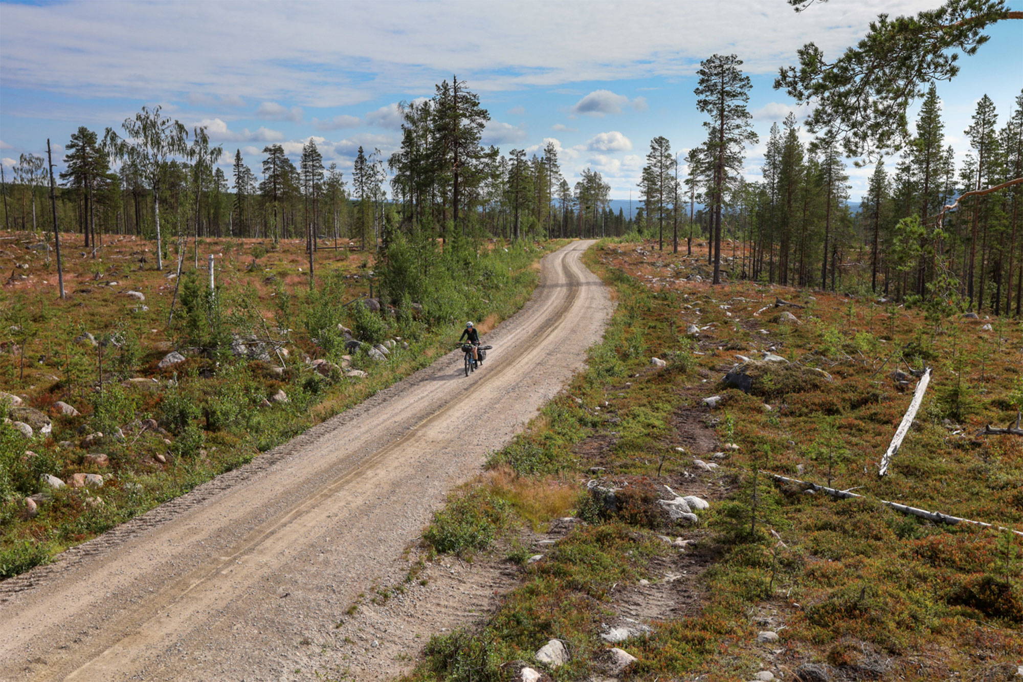 Katrien riding a scenic gravel path