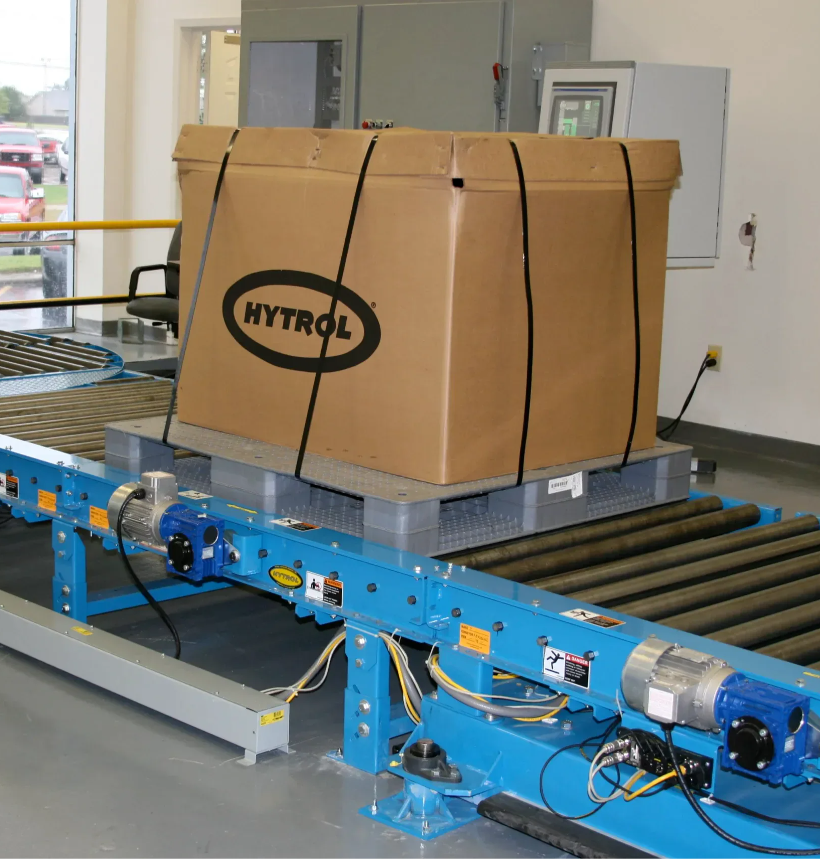 Hytrol pallet conveyor carrying a pallet