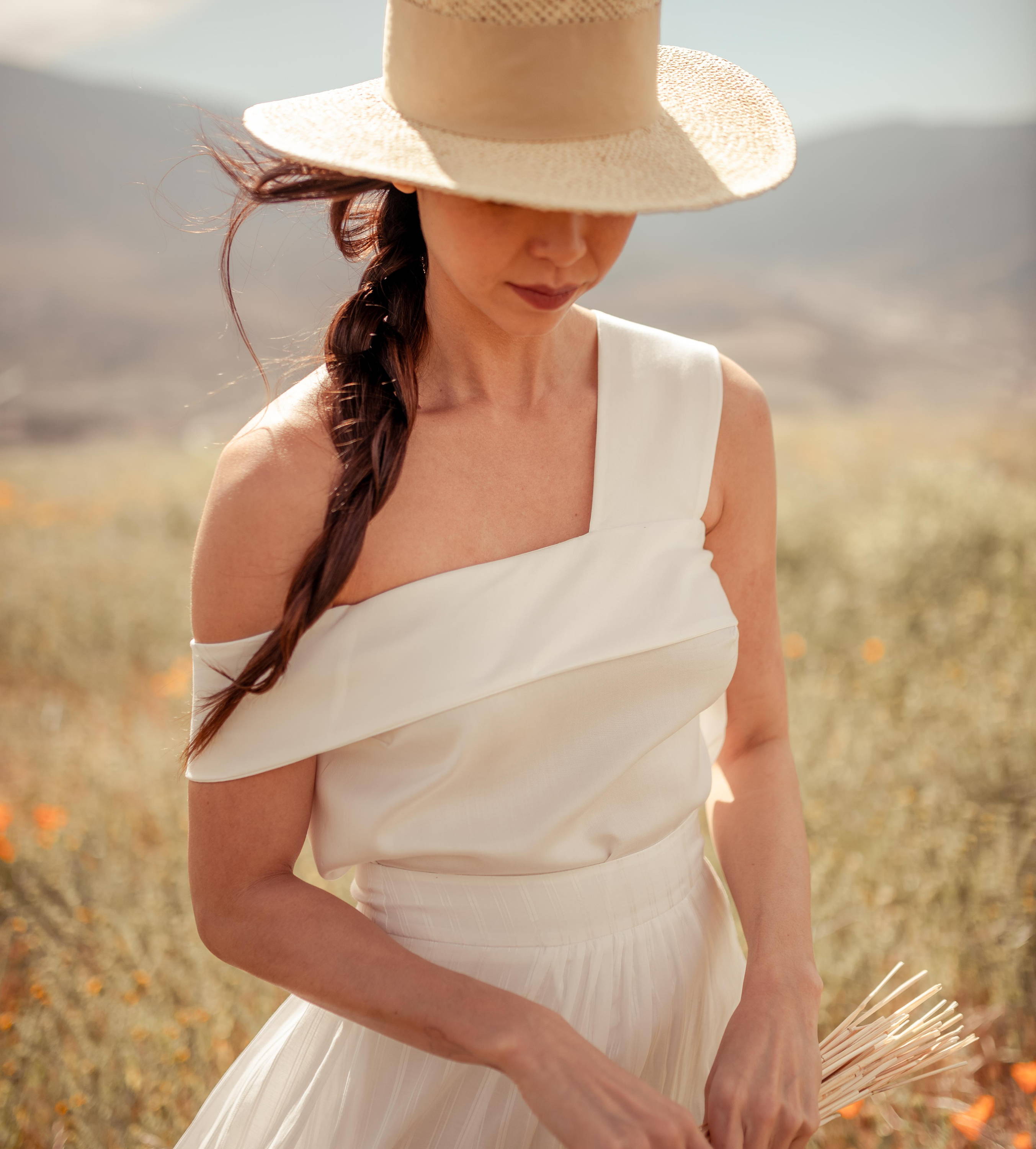 woman wearing white tencel top with off shoulder strap