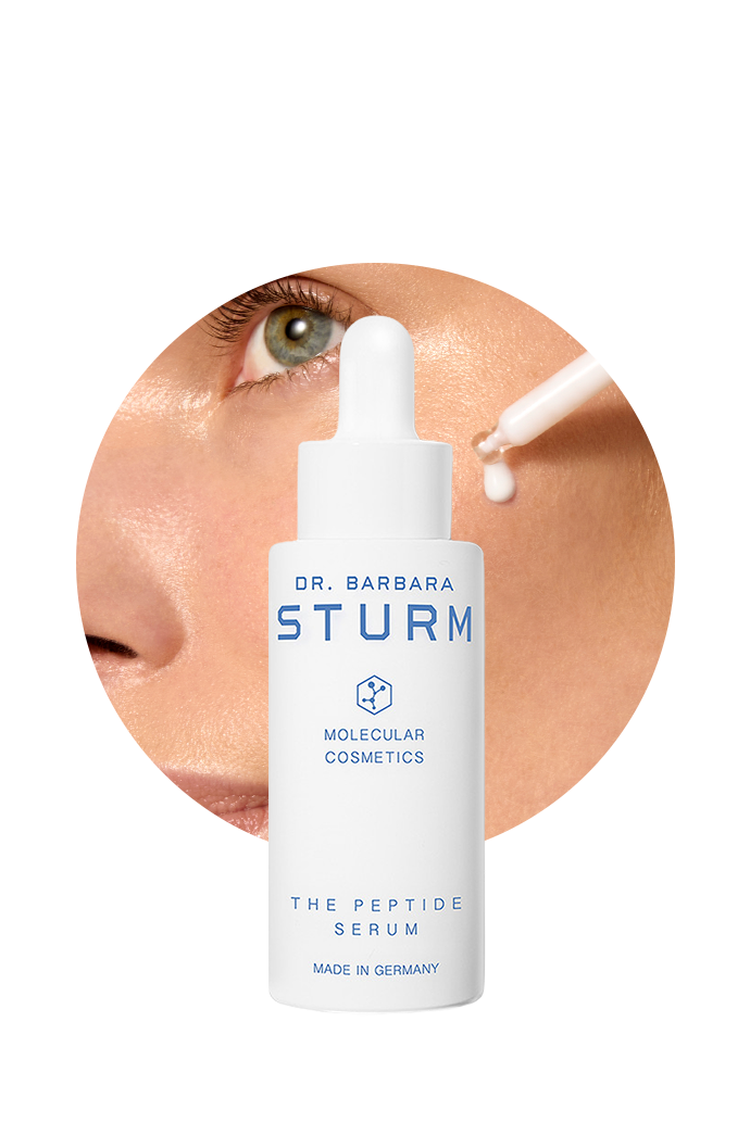 Bottle of Dr. Barbara Sturm peptide serum with application near an eye.