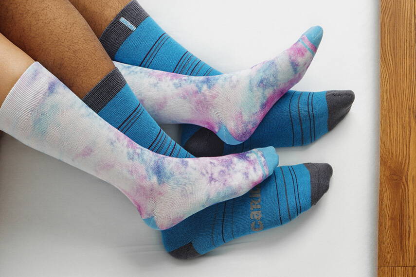 man and woman wearing socks