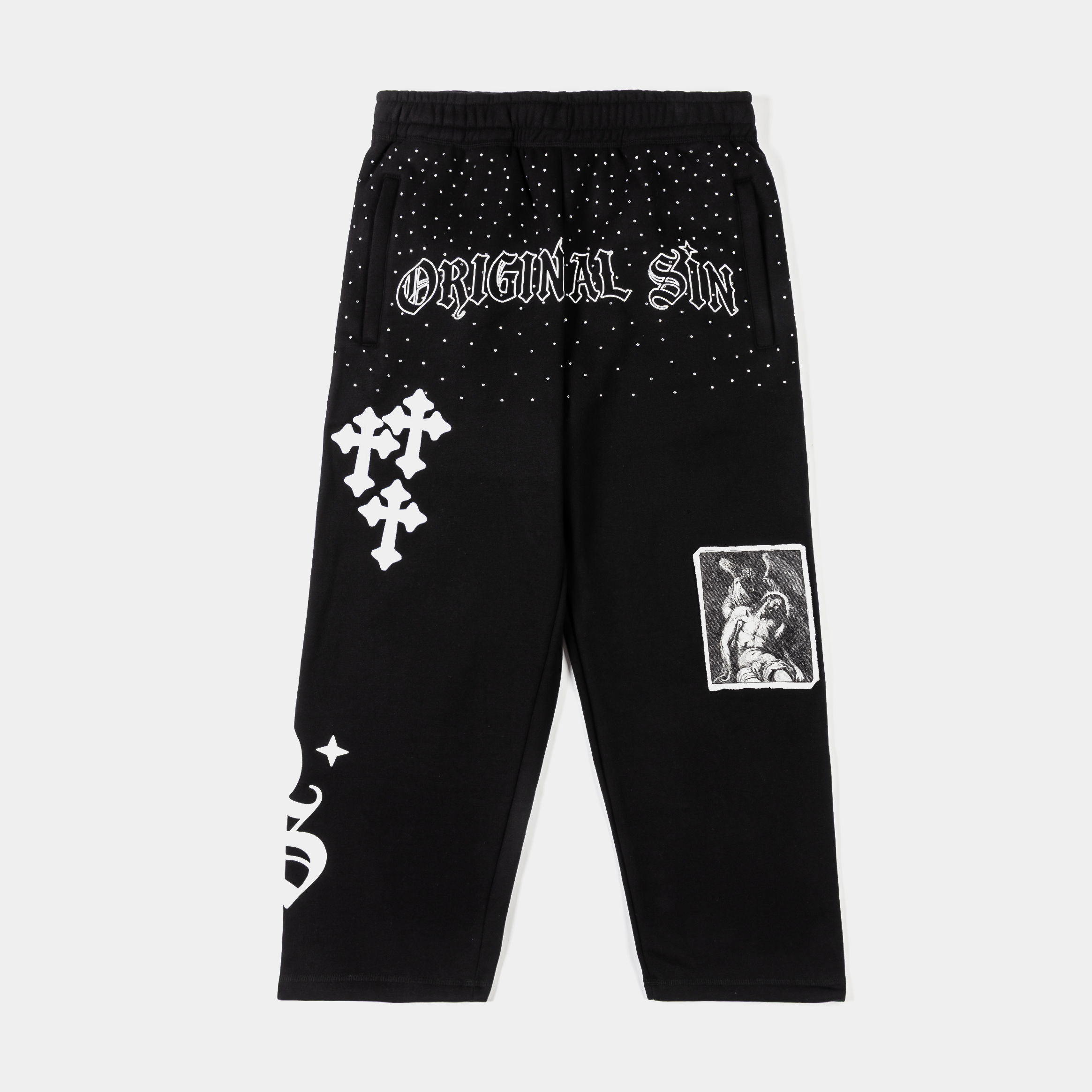 Black pants with various graphic designs and text.
