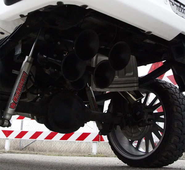 Five black train horns and McGaughy's suspension mounted under Cristian's Silverado photo 3