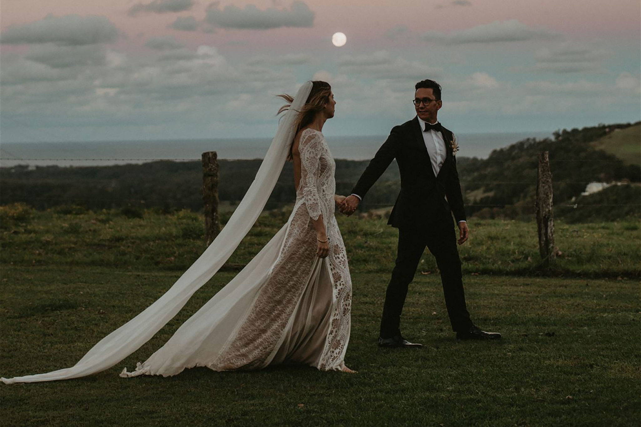 Grace Loves Lace bride in the Inca gown  with groom underneath the moon