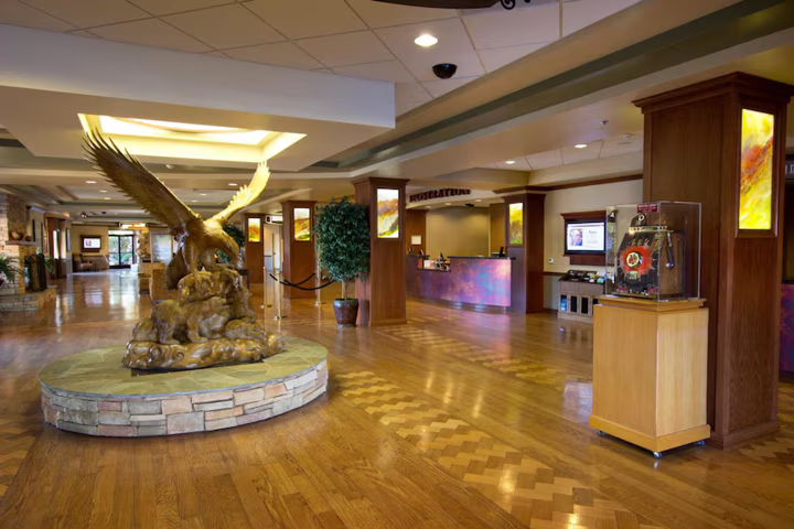 Jackson Rancheria Casino Resort Lobby interior featuring a large eagle sculpture and wooden flooring.