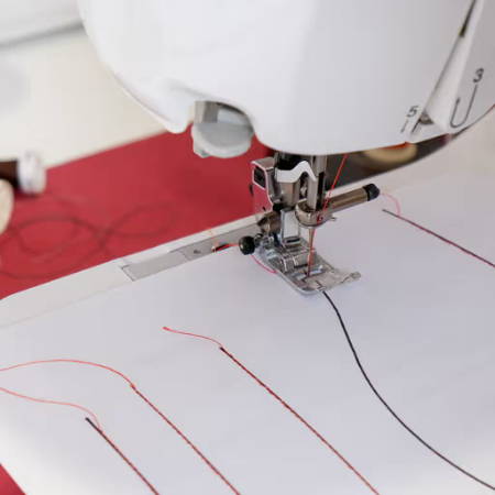 start sewing on paper practice sheet with a sewing machine