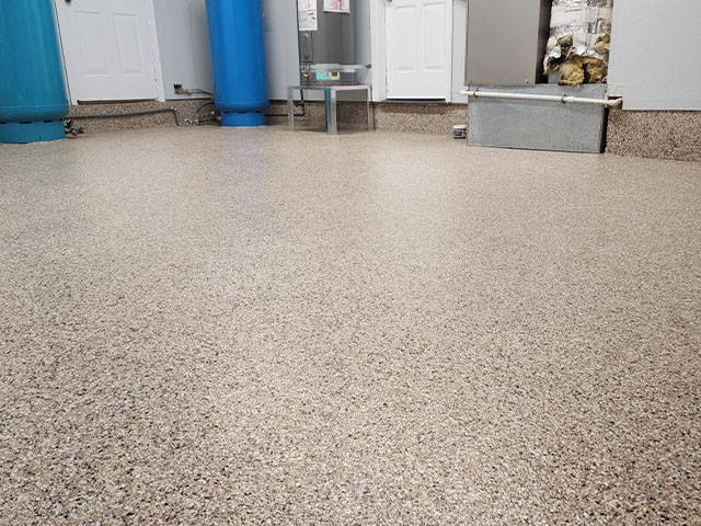 Completed project with new epoxy floor ready for light foot traffic in 24 hours, and vehicle parking in 72 hours. Easy to clean and chemical resistant