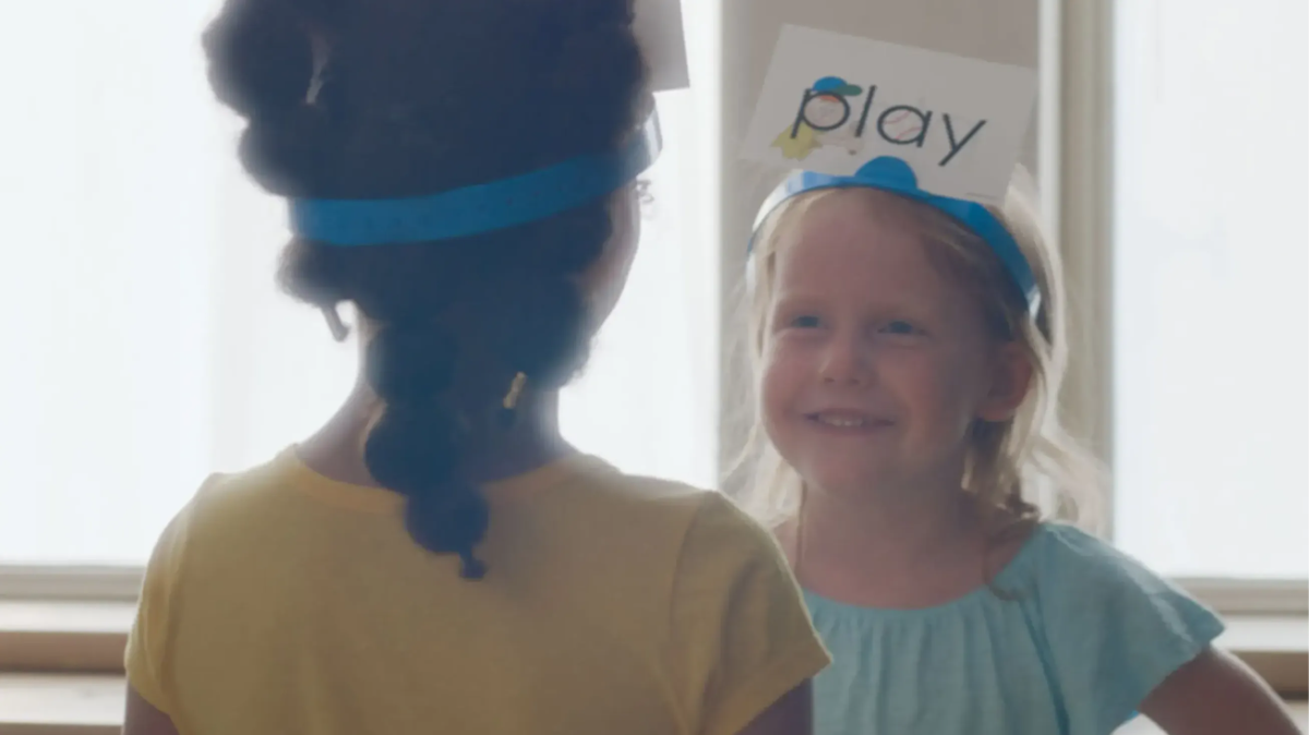 Two children playing with Eyeword Flashcards