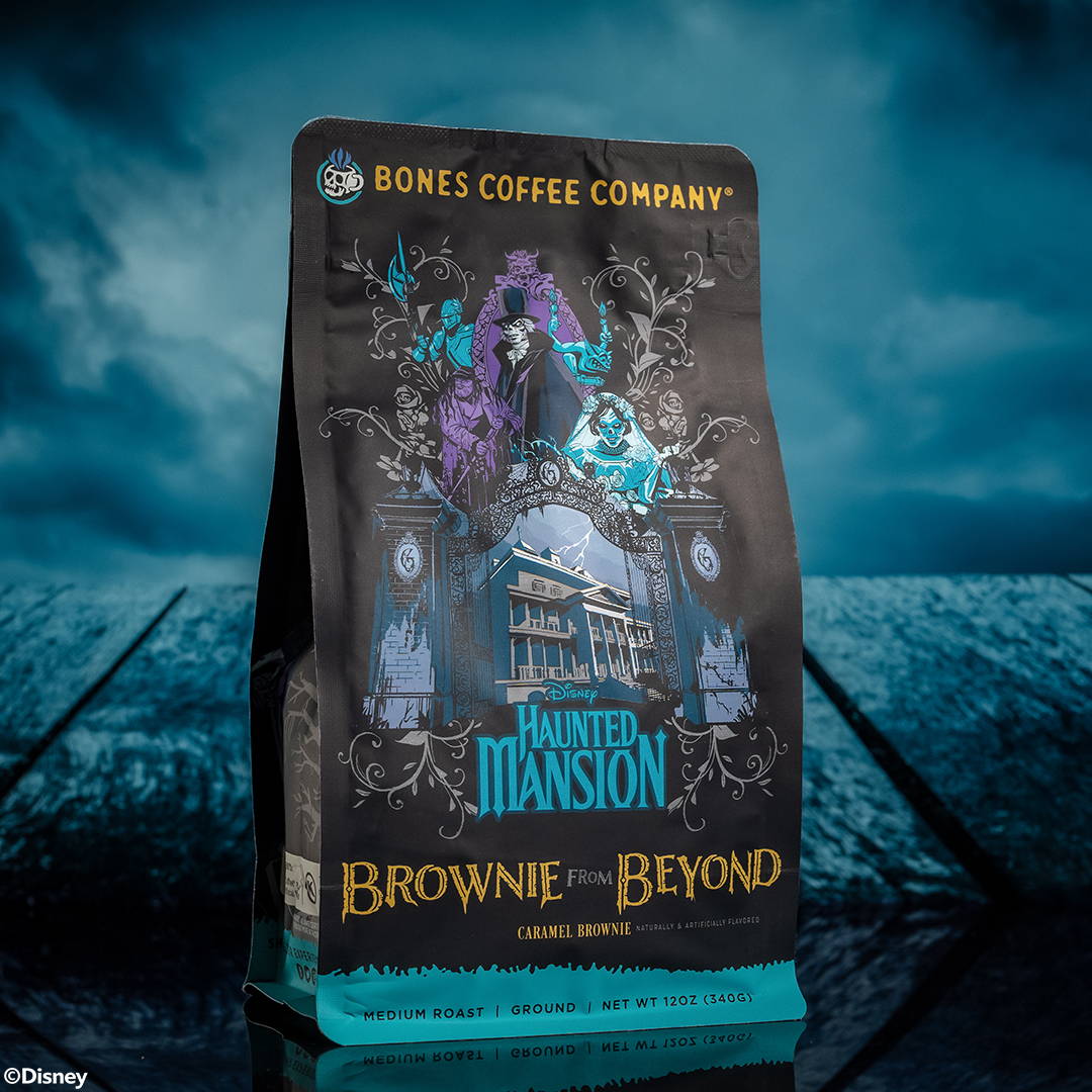 A 12 ounce bag of coffee inspired by Disney Haunted Mansion named Brownie From Beyond. It is caramel brownie flavored and features the Haunted Mansion alongside characters from Disney Haunted Mansion.