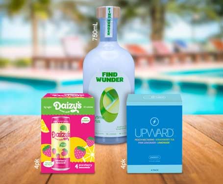 Bottles of beverages with a tropical background and wooden table.