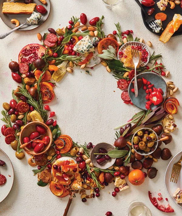 Assorted charcuterie board items around in the shape of a wreath