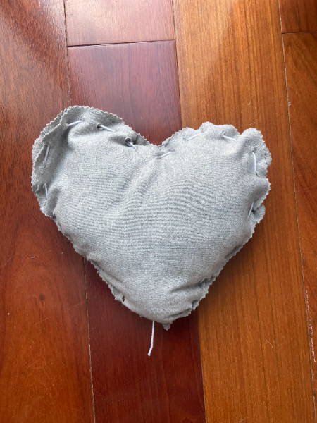 finished fabric heart pillow in gray knit fabric