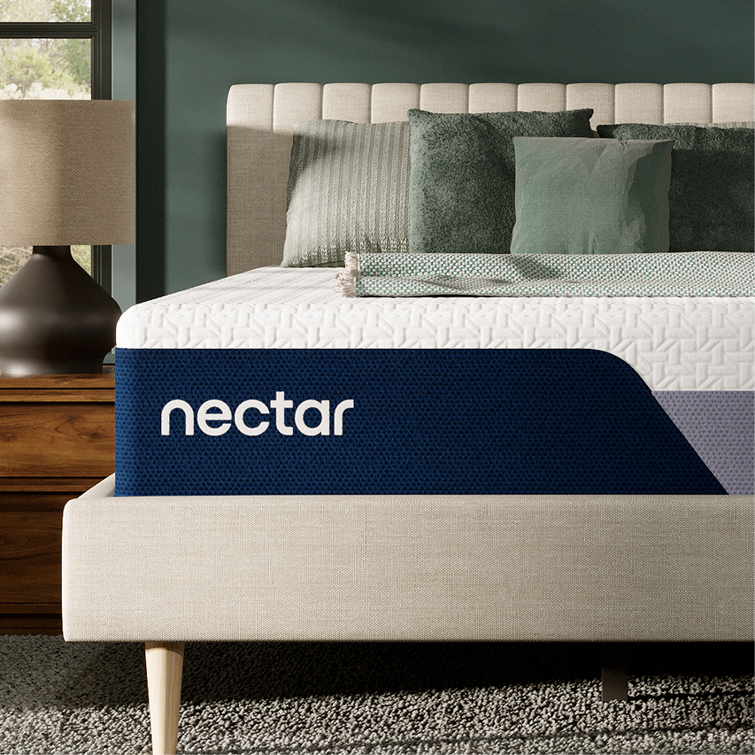 Mattress display featuring Nectar mattress branding and layered bedding.