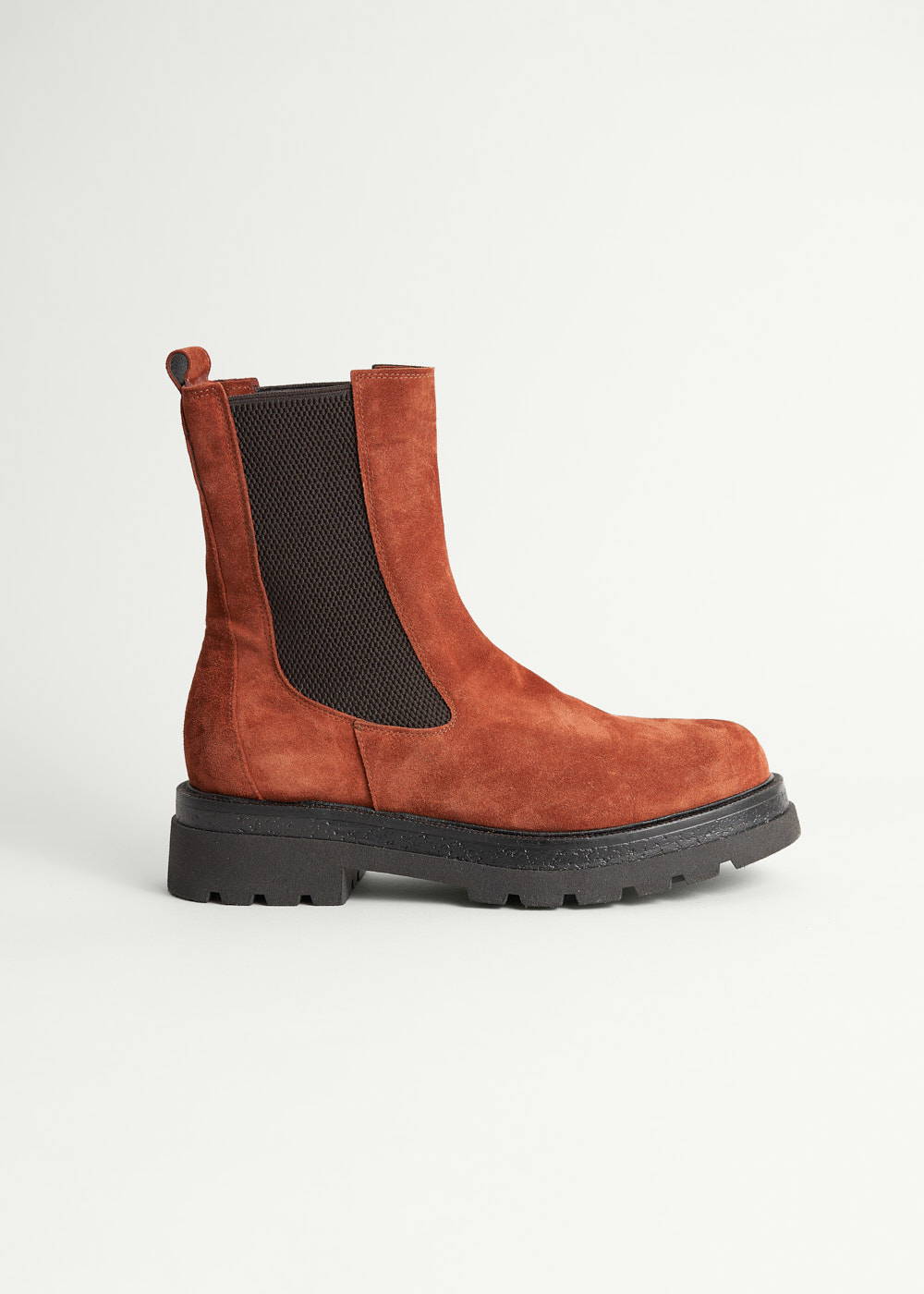 A pair of rust suede chelsea boots