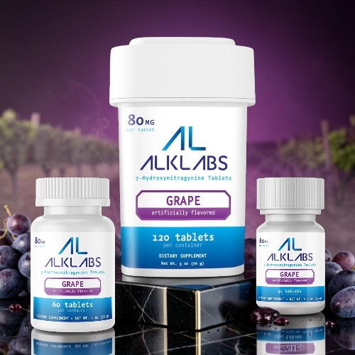Bottles of ALKLABS grape supplements on a purple background.