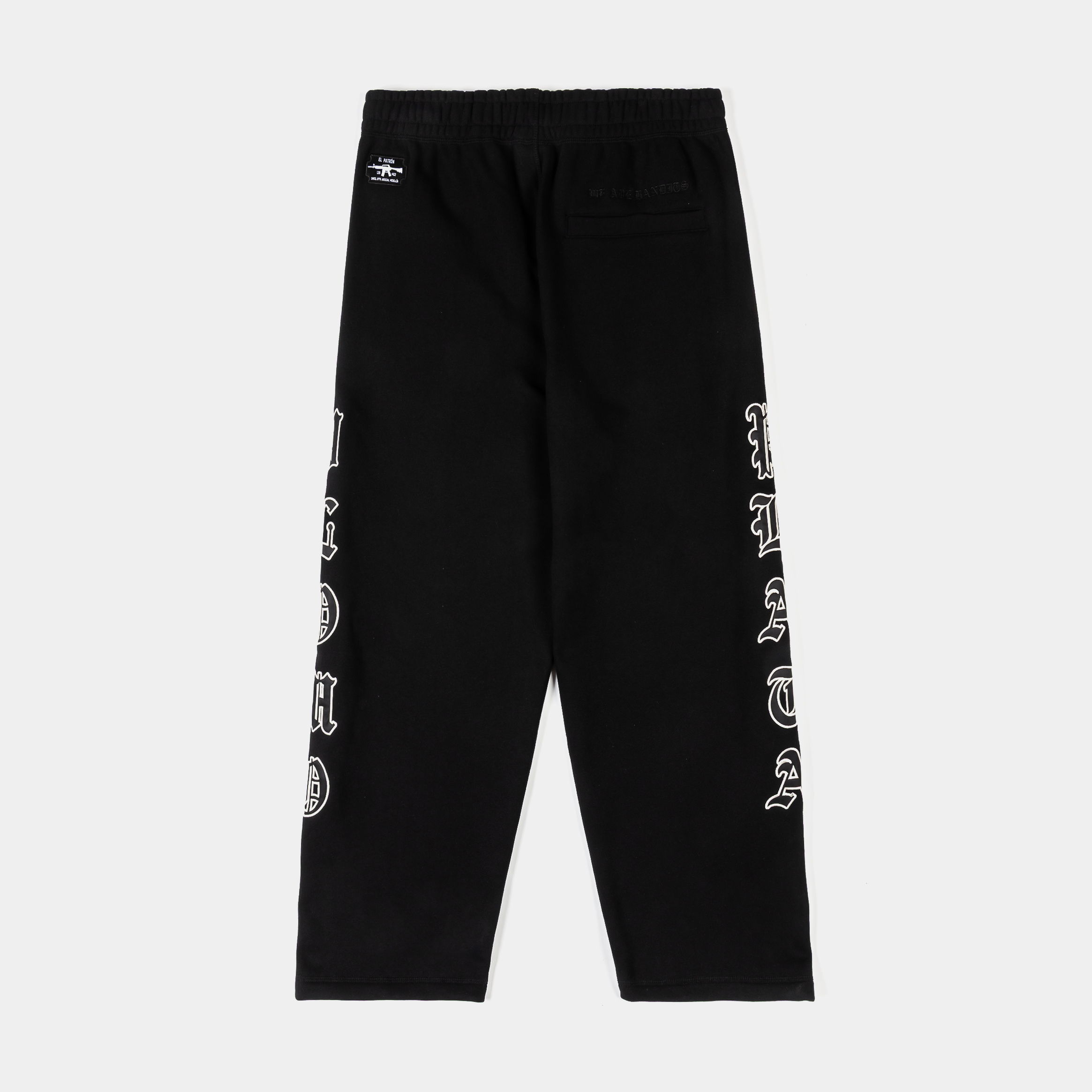 Black pants with a logo and designs on the sides.