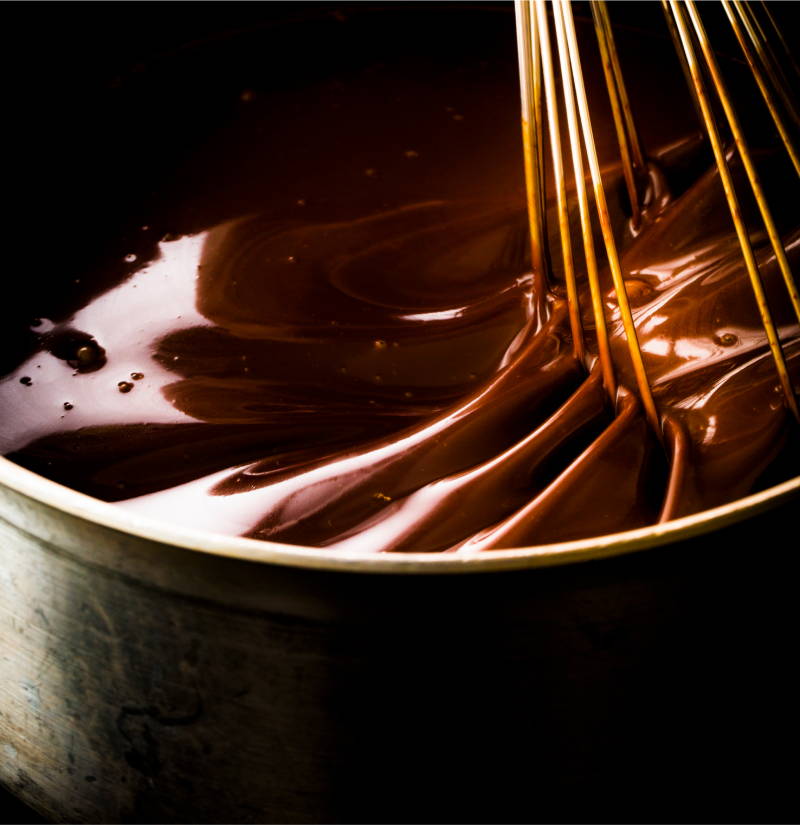 Chocolate sauce being whisked
