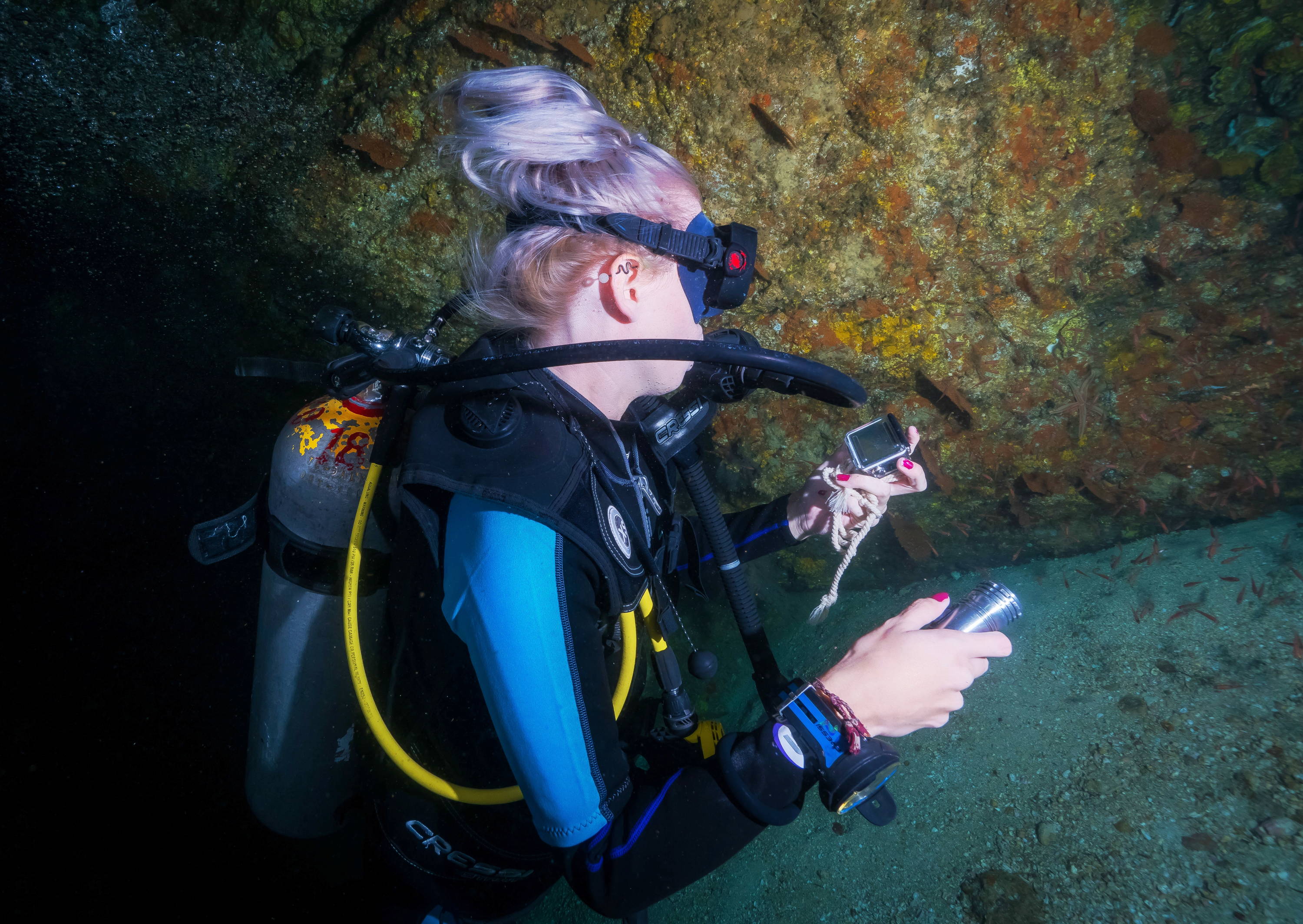 woman scuba diving in cold water