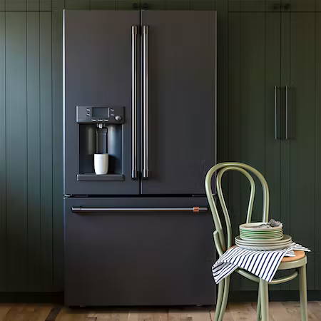 matte black French door refrigerator in sage green cabinets