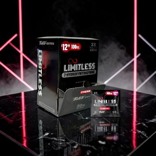 Box of Limitless energy drink with neon lights in background.